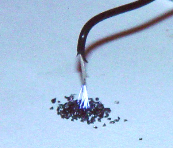 Sparks hitting black powder