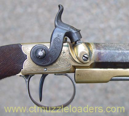 Side view of Cogswell belt pistols